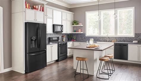 black fridge in white kitchen